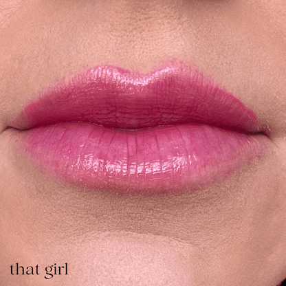 Close-up of glossy pink lips with the text &