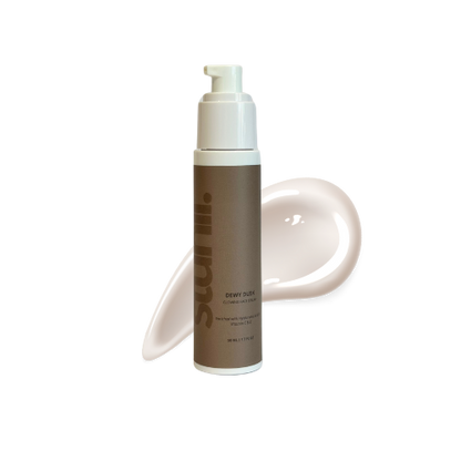 Skincare product with pump bottle and spreadable texture on white background