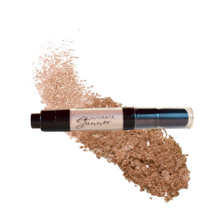 A tube of Stunner Shimmer highlighter with a sample of the shimmer dust powder displayed in back, against a white background.
